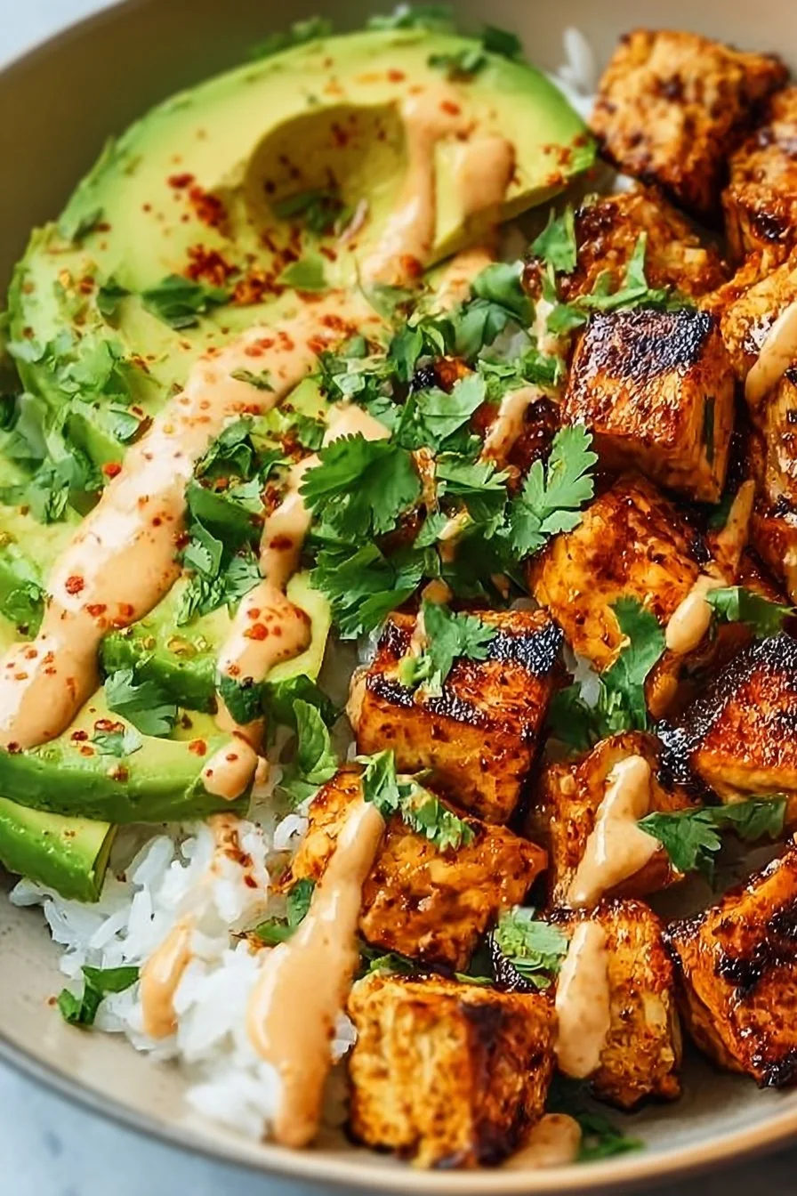 Coconut Chicken Rice Bowl: A Tropical Twist in 20 Minutes 1 Coconut Chicken Rice Bowl with vibrant vegetables and rice for a tropical meal