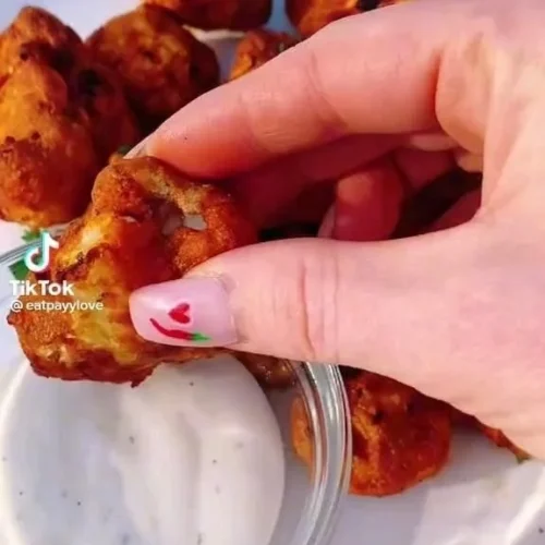 Spicy Buffalo Cauliflower Bites on a plate ready to be enjoyed.