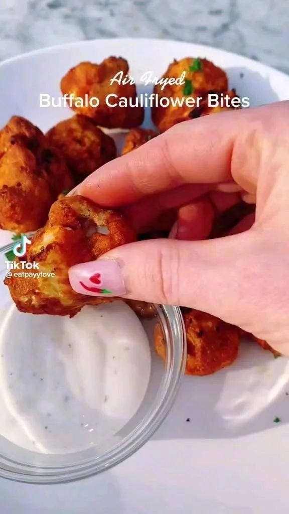 Spicy Buffalo Cauliflower Bites on a plate ready to be enjoyed.
