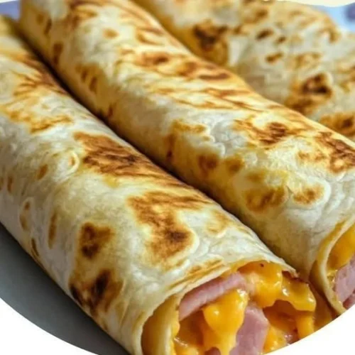 Easy air fryer hot ham and cheese wraps served on a plate