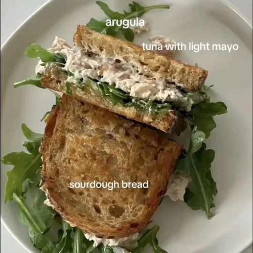 Assorted healthy snacks including fruits, nuts, and veggie sticks