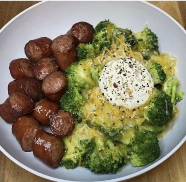 Colorful meal prep containers with healthy high protein dishes and fresh ingredients.