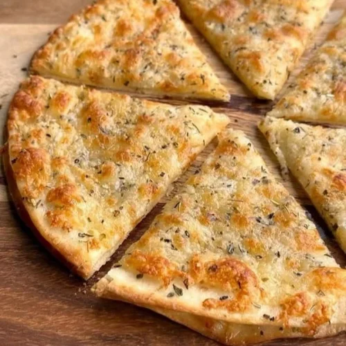 Air Fryer Garlic Bread served on a plate, golden and crispy.