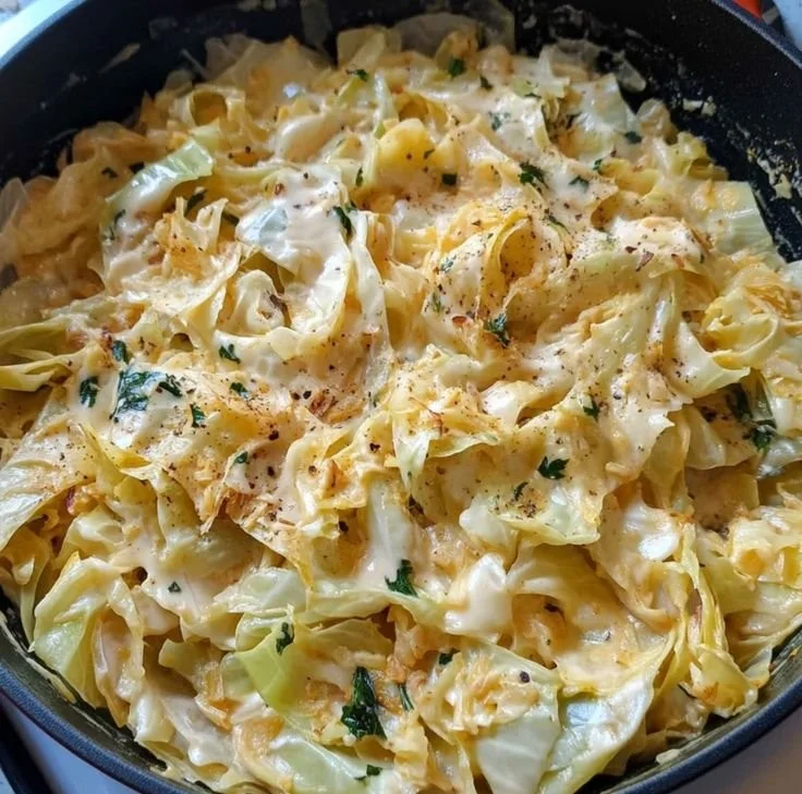 Creamy Cabbage Alfredo served in a bowl with garlic and herbs.