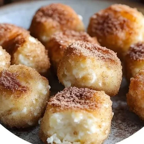 Cinnamon Apple Cottage Cheese Bites served in a bowl with fresh apple slices