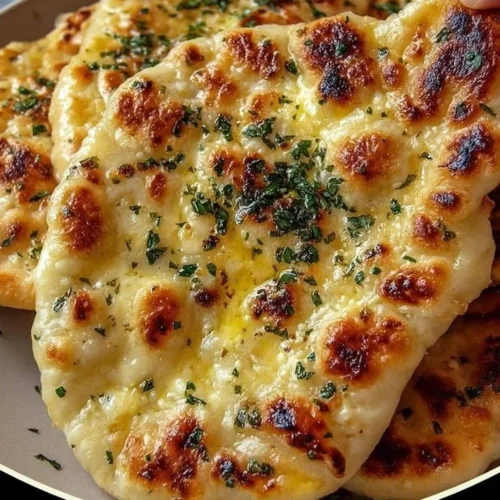 Cottage Cheese Garlic Skillet Naan served with herbs and spices