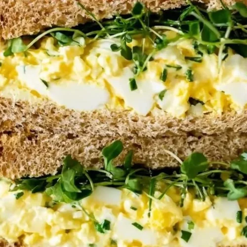 Creamy cottage cheese egg salad in a bowl with fresh herbs