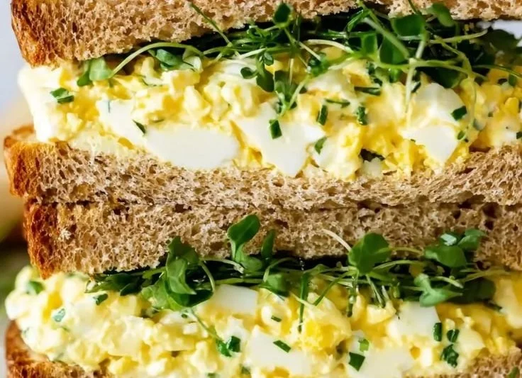 Creamy cottage cheese egg salad in a bowl with fresh herbs