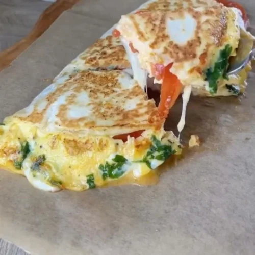 Easy Breakfast Wrap 2 Delicious easy breakfast wrap filled with eggs, veggies, and cheese