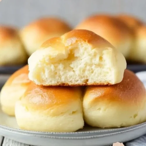 Easy Recipes - Fluffy Cottage Cheese Cloud Bread 2 Fluffy cottage cheese cloud bread fresh out of the oven on a baking sheet.