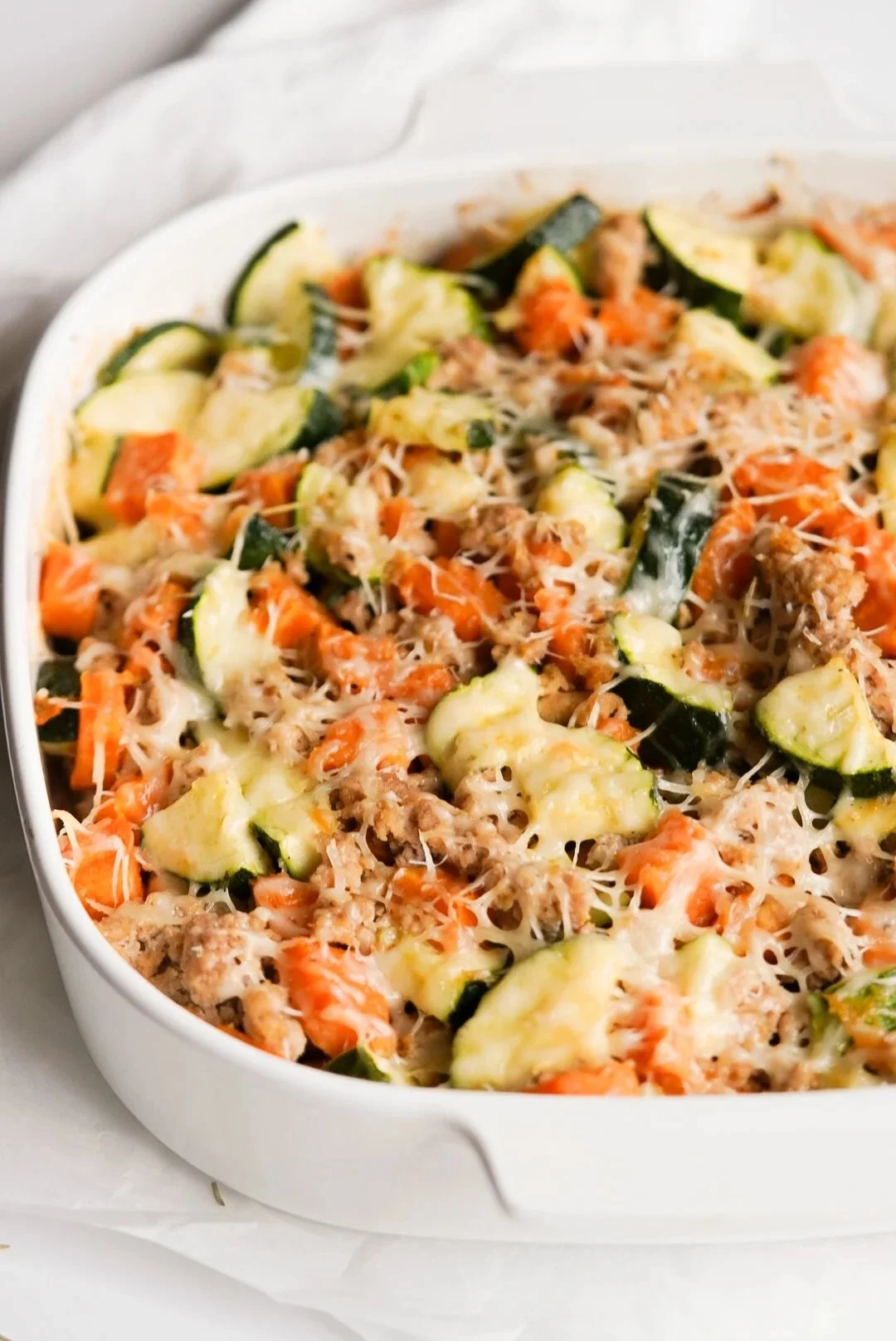 Ground Turkey Sweet Potato Bake topped with herbs in a casserole dish