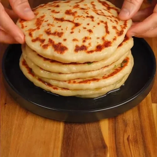 High protein cheesy garlic naans with herbs and melty cheese