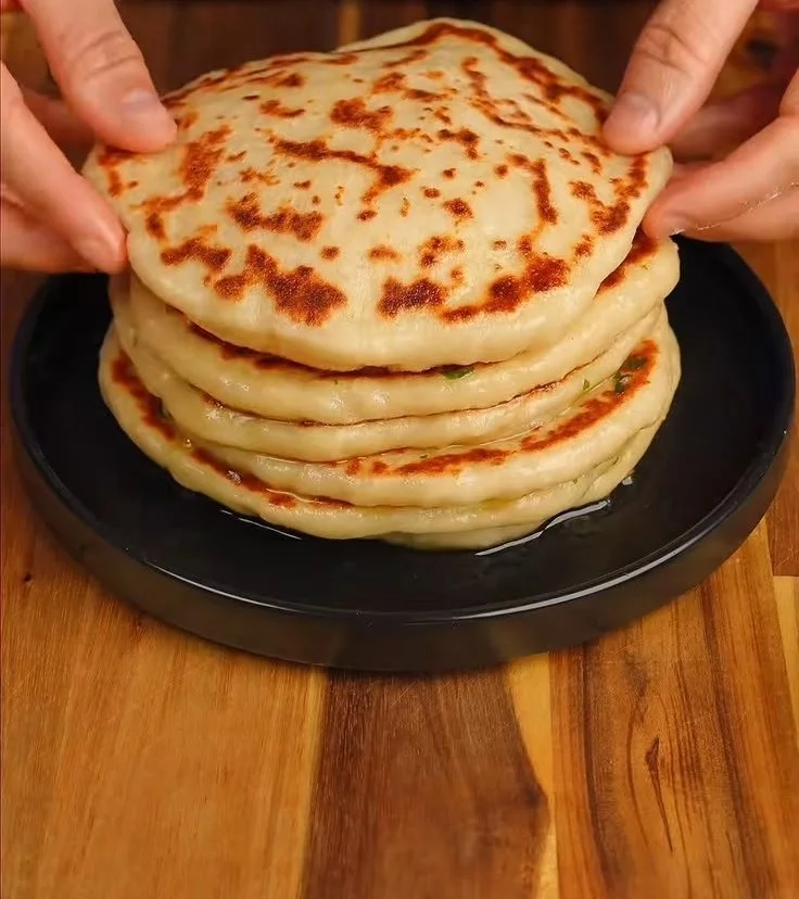 High protein cheesy garlic naans with herbs and melty cheese