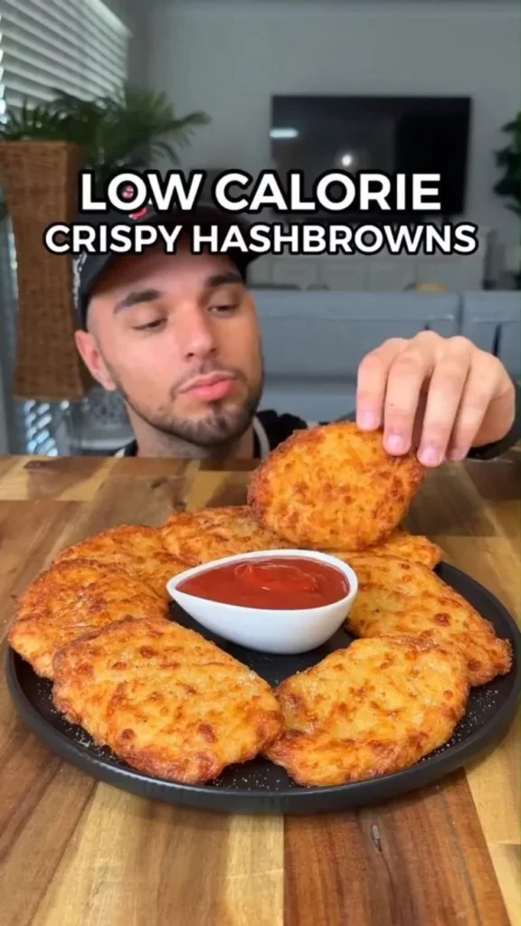 Low-calorie crispy hashbrowns served on a plate with garnish