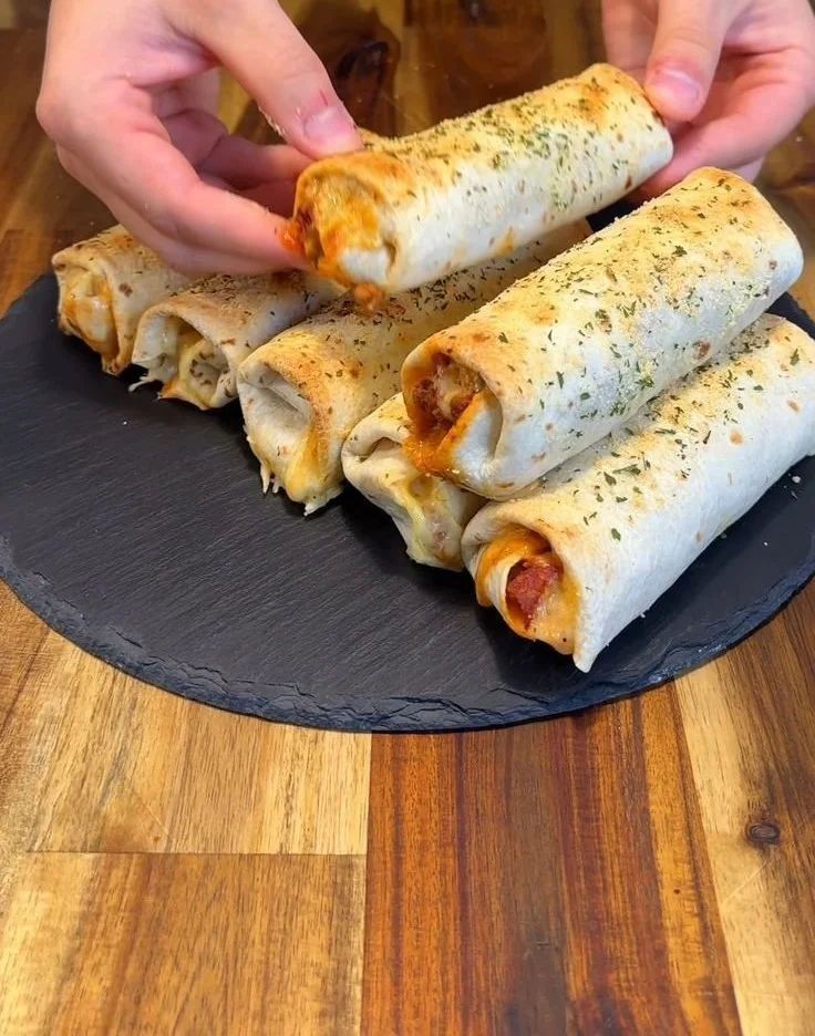 Low-calorie pepperoni pizza rolls on a plate, ideal for a healthy snack.