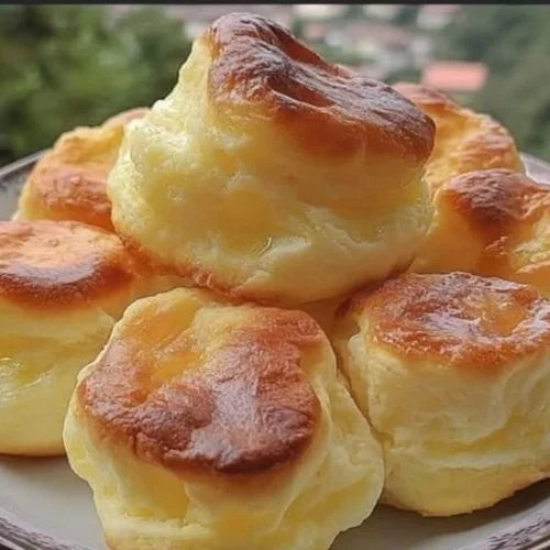 Delicious Nun's Puffs pastries on a plate, emphasizing their airy texture and golden color