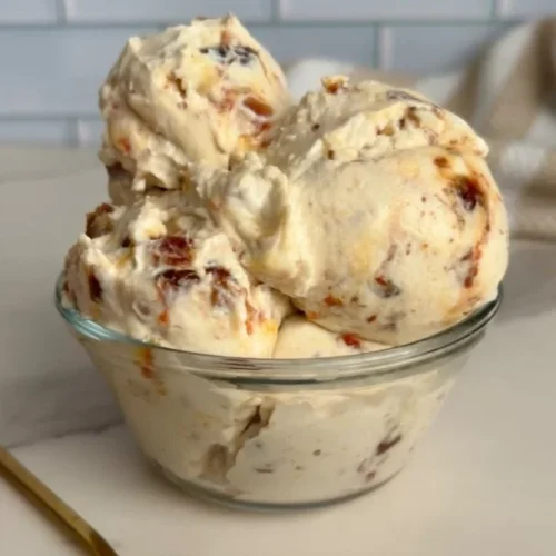 Delicious bowl of salted caramel cottage cheese ice cream topped with caramel sauce