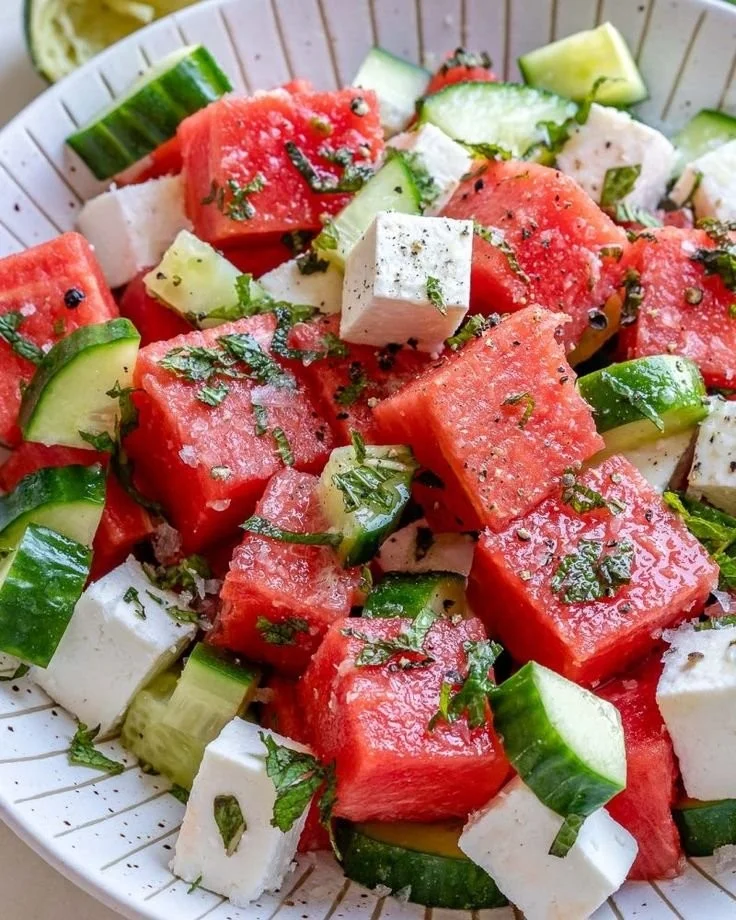 Simple watermelon cucumber salad with feta cheese in a bowl