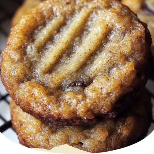 Homemade banana bread cookies displayed on a wooden table with chocolate chips.